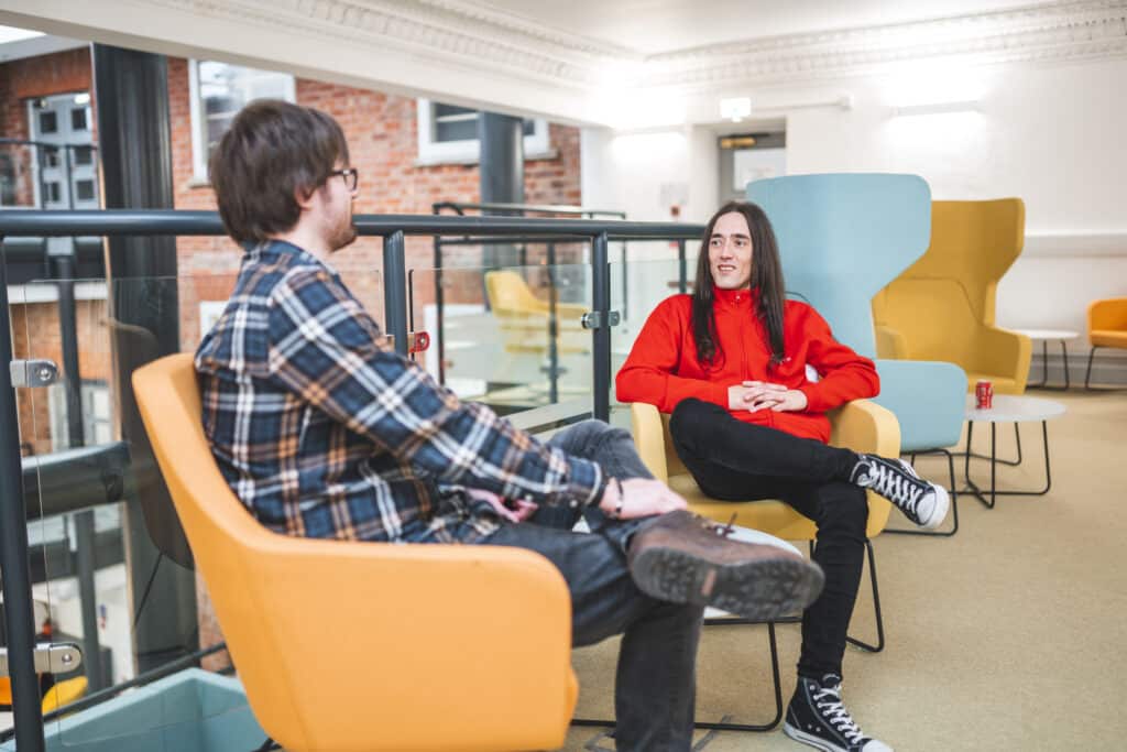 Laravel website developer & WordPress Website designer sat chatting at Red Box Offices