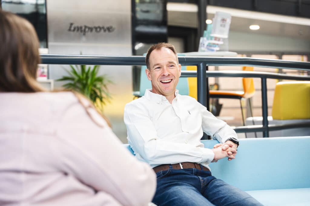 Rob Mackley chatting on a sofa at the Shire Hall in Stafford about Website Landing Pages
