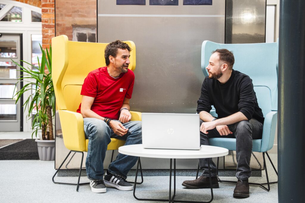Web Design Team discussing importantance of great website copywriting in the Shire Hall Business Centre in Stafford.
