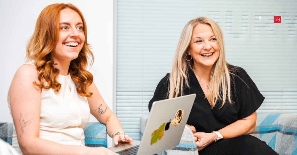 Professionals discussing website strategy as businesses adapt SEO for AI search results and changing search behaviour