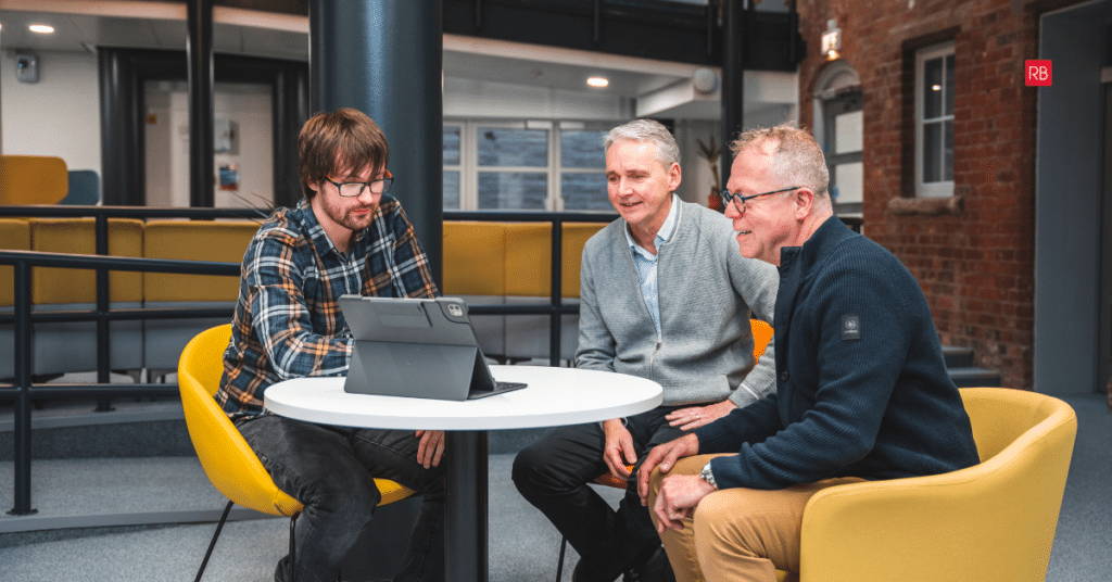 Red Box team reviewing a manufacturing website with a client