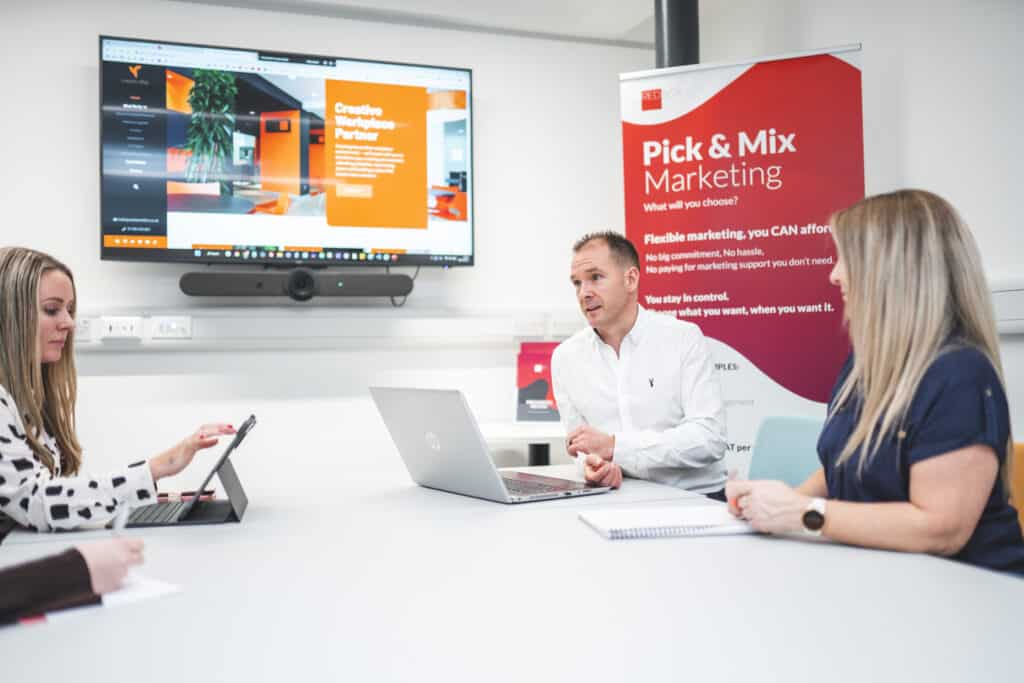 Client consultation discussing website design requirements and goals