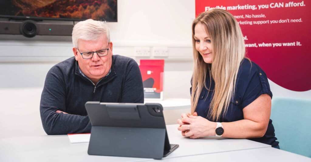 No1 Guide to SEO for Industrial and Machinery Companies 1 SEO client meeting with seo expert and a SEO customer reviewing the websites SEO on a Ipad.